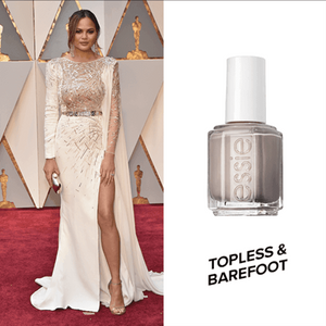 Chrissy Teigen wearing Essie Topless & Barefoot nail polish