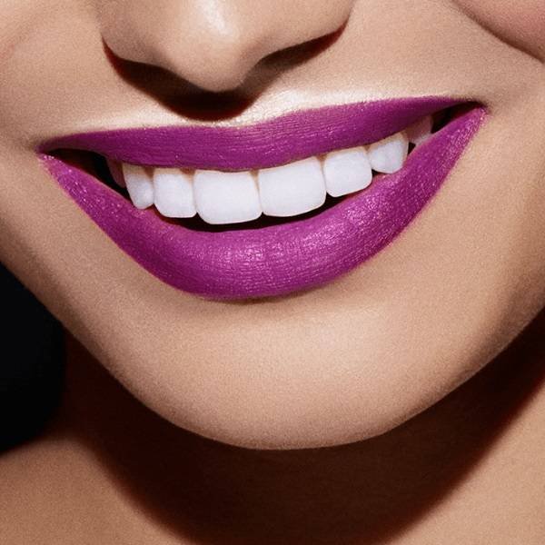 close-up of person wearing purple lipstick