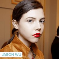 person wearing red glossy lipstick