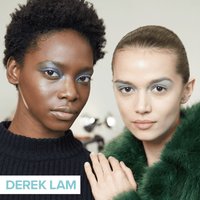 two people looking into camera and posing wearing metallic eye makeup