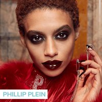 person wearing dark lipstick and eye makeup