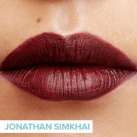 close up of lips wearing dark red lipstick