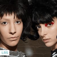 two people looking into camera and posing