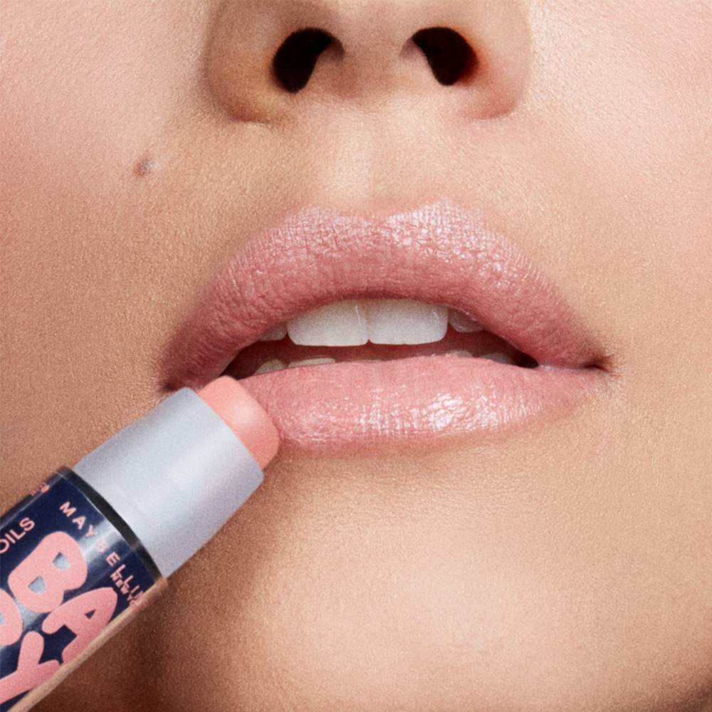 close-up of lip balm being applied to lips