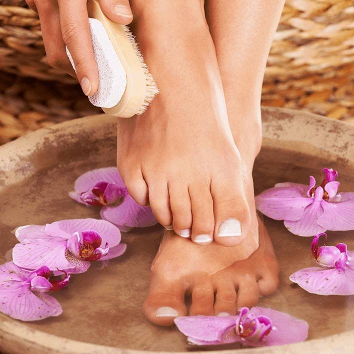feet in pedicure bowl