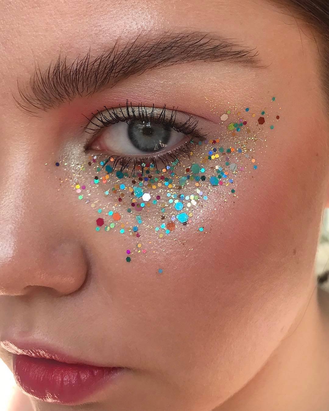 person wearing confetti as under eye makeup
