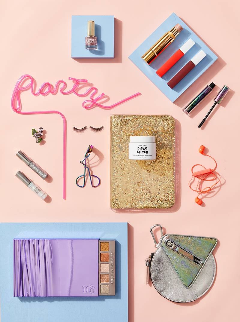 various makeup products styled on neutral background