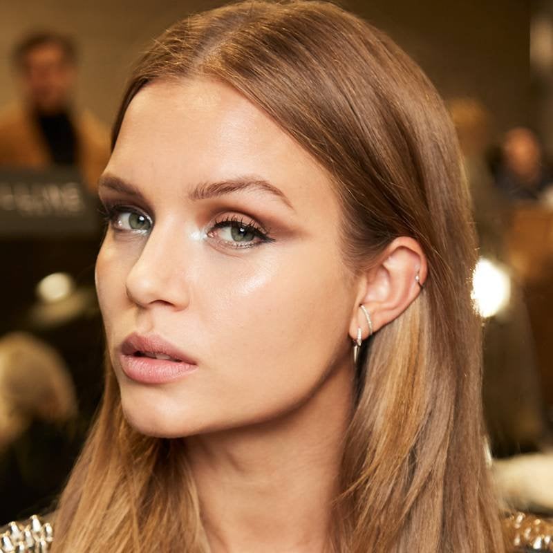 person wearing copper and silver eyeshadow