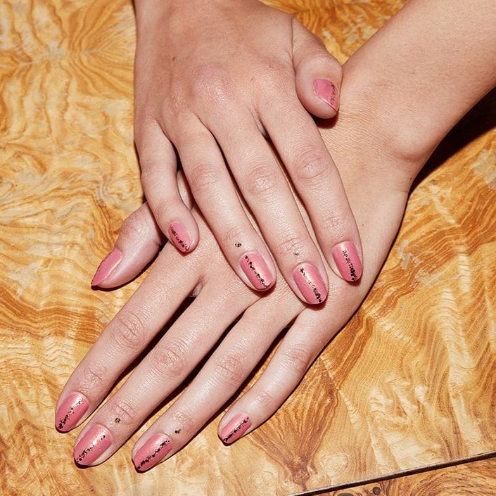 hands with nails painted and nail polish on skin