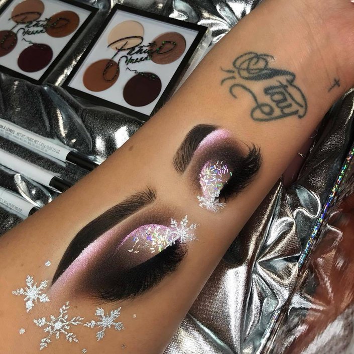 eye makeup drawn on person's inner arm