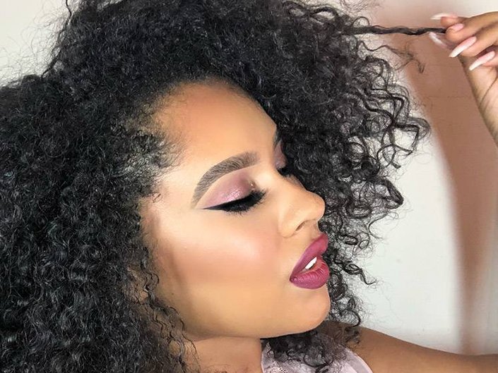 person wearing burgundy eyeshadow and lipstick