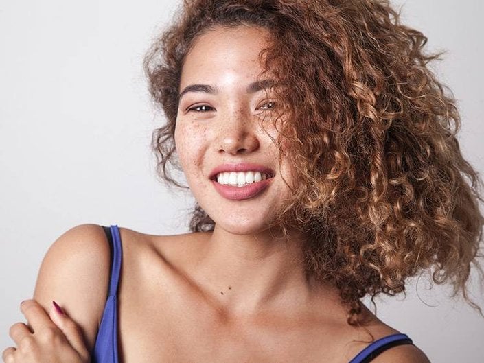 person with naturally curly hair