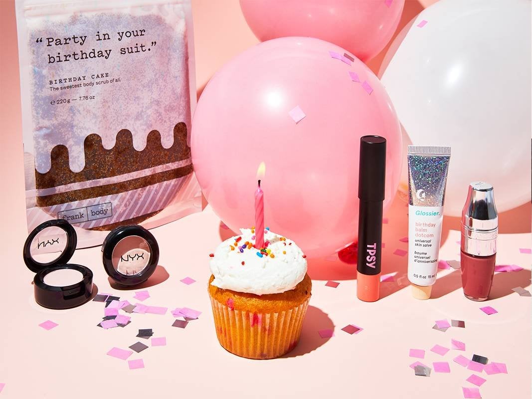 makeup products, balloons, confetti, and a cupcake