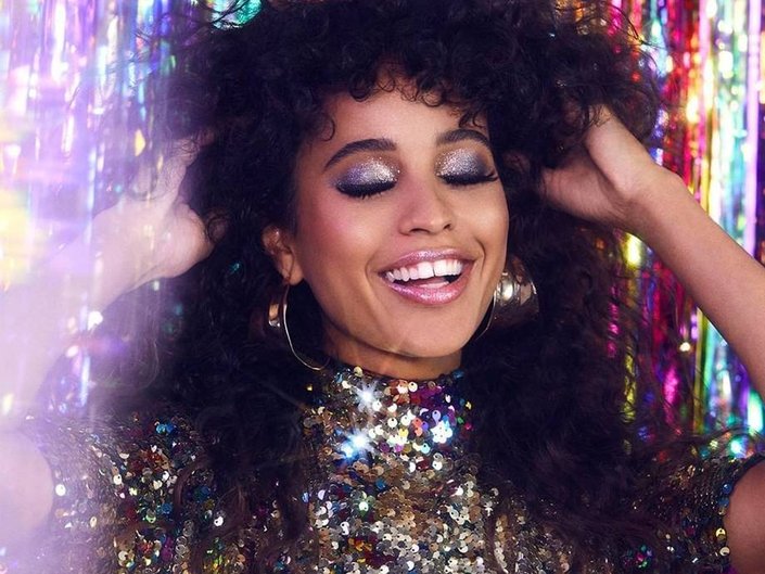 person wearing glitter eyeshadow and lipstick