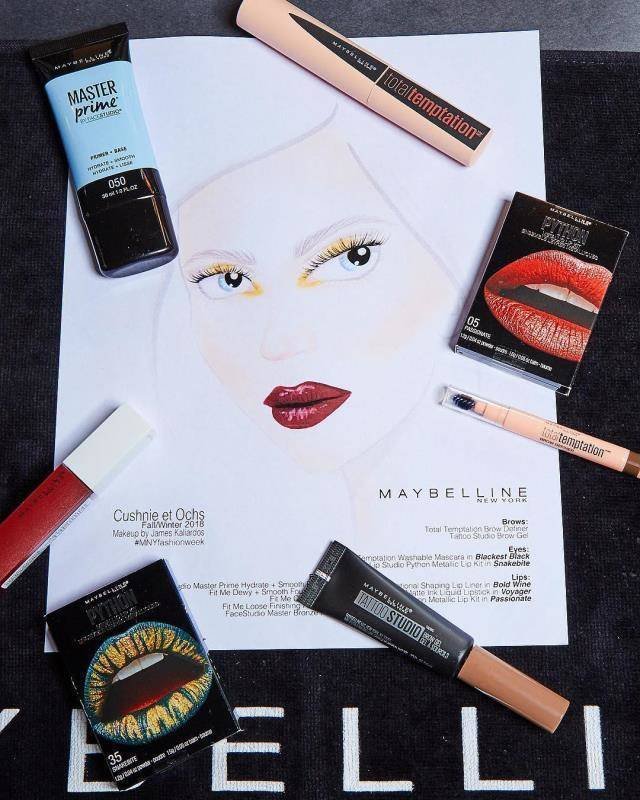 maybelline makeup products surrounding illustration of person wearing red lipstick and yellow eyeshadow