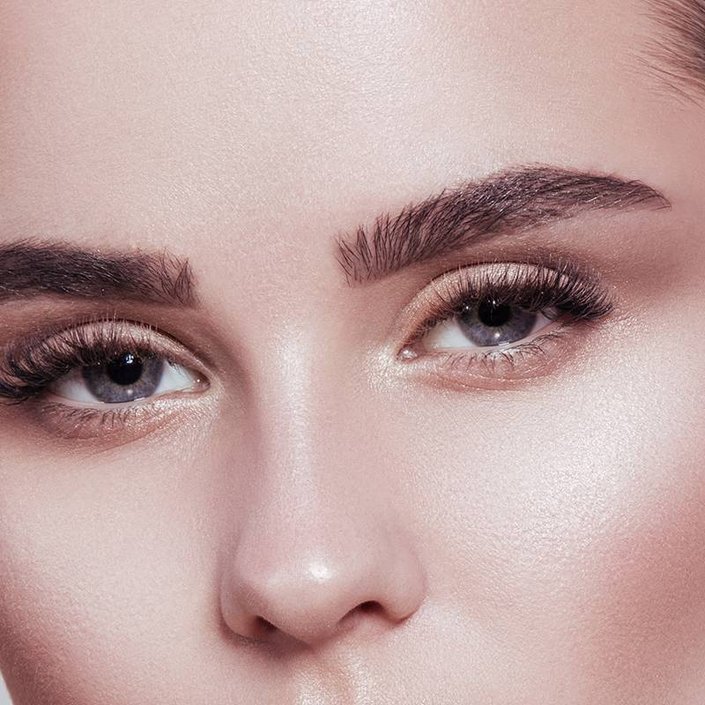 person wearing gold shimmering eyeshadow