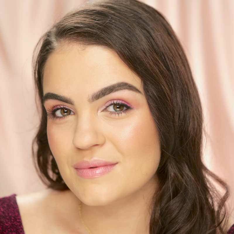 person wearing light pink eyeshadow and lipstick