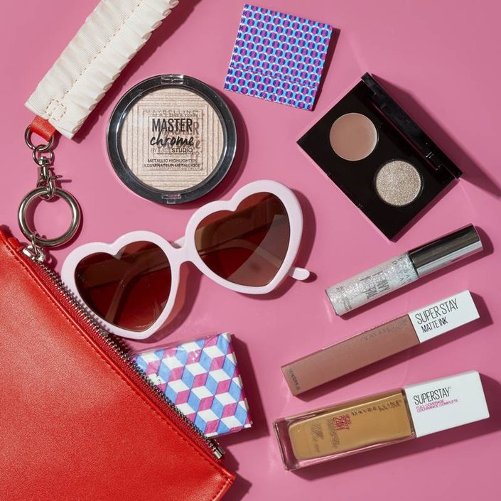 makeup products spilling out a makeup bag