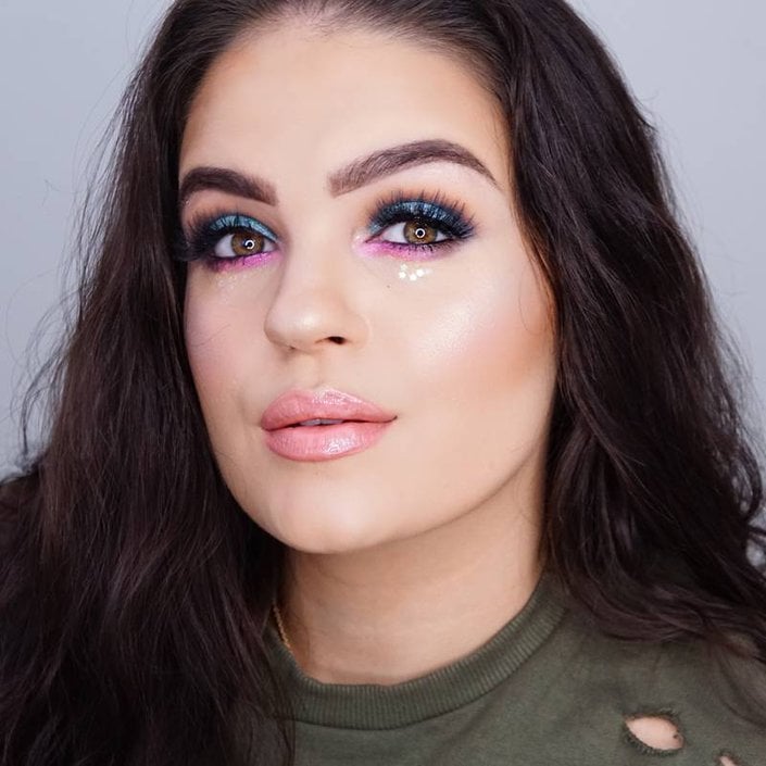 person wearing blue and pink eyeshadow