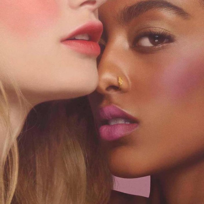 two people wearing bright blush and lipstick