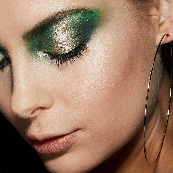 person wearing green and gold eyeshadow
