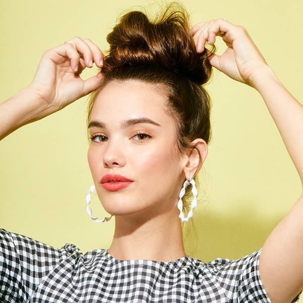Hair Tutorial Three Step Messy Bun Makeup Com That said, you want to keep every out of place strand…ahem…in place. hair tutorial three step messy bun