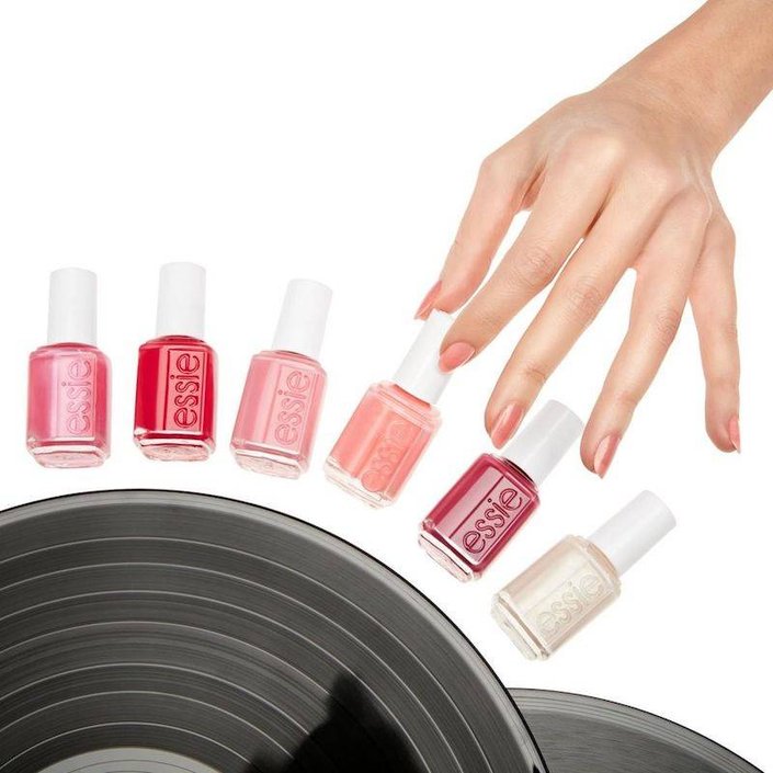 hand grabbing essie nail polish bottle