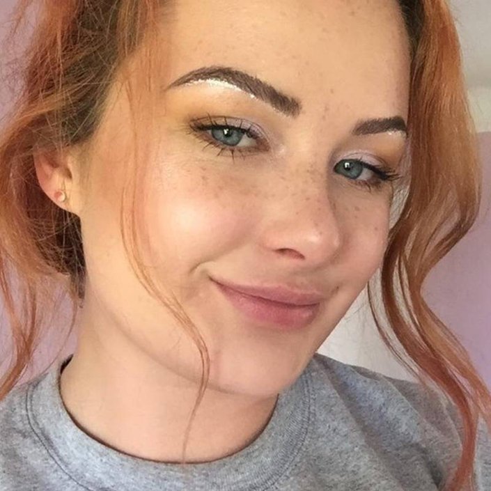 person with eyebrows lined with silver glitter