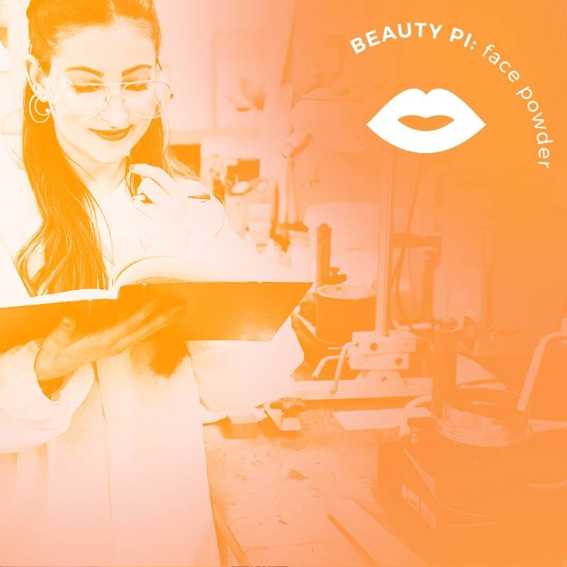 person wearing goggles and reading a notebook in a beauty lab
