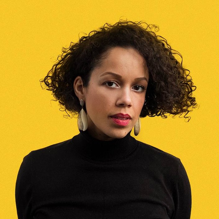 person with naturally curly hair cut into bob