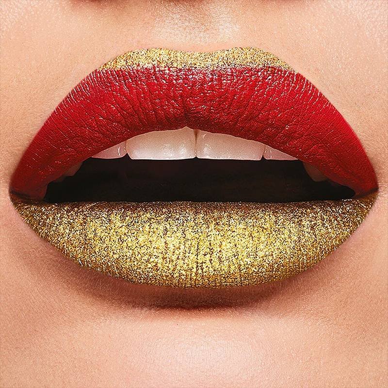 lips wearing red and gold lipstick