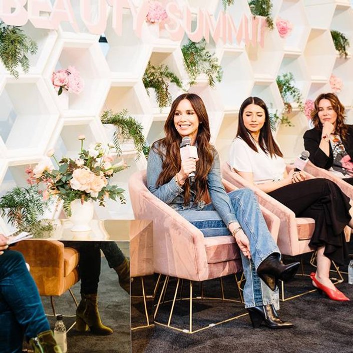 three panelists on stage at beauty summit