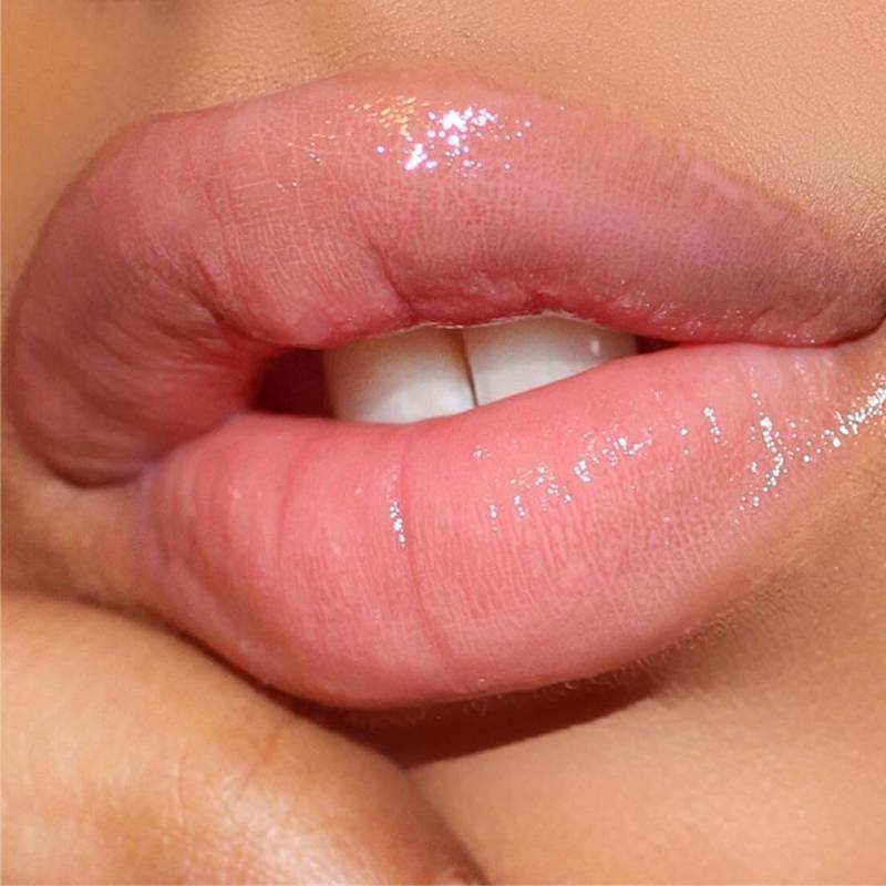 lips wearing pink lip gloss