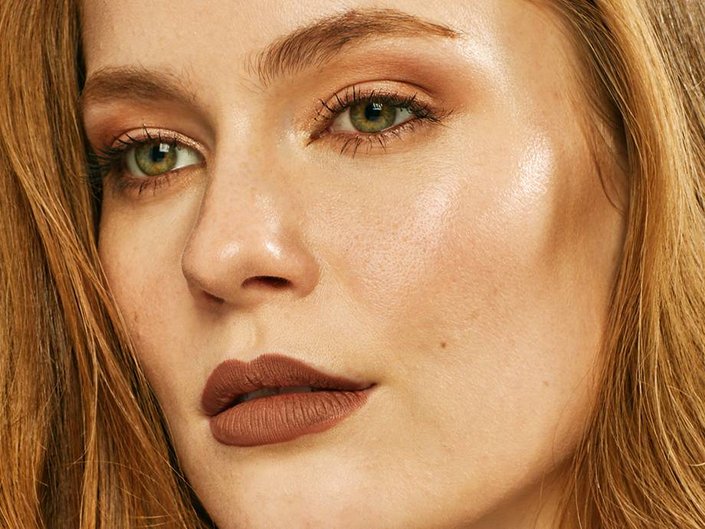 person wearing brown monochrome makeup