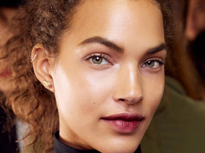 person wearing berry lip stain