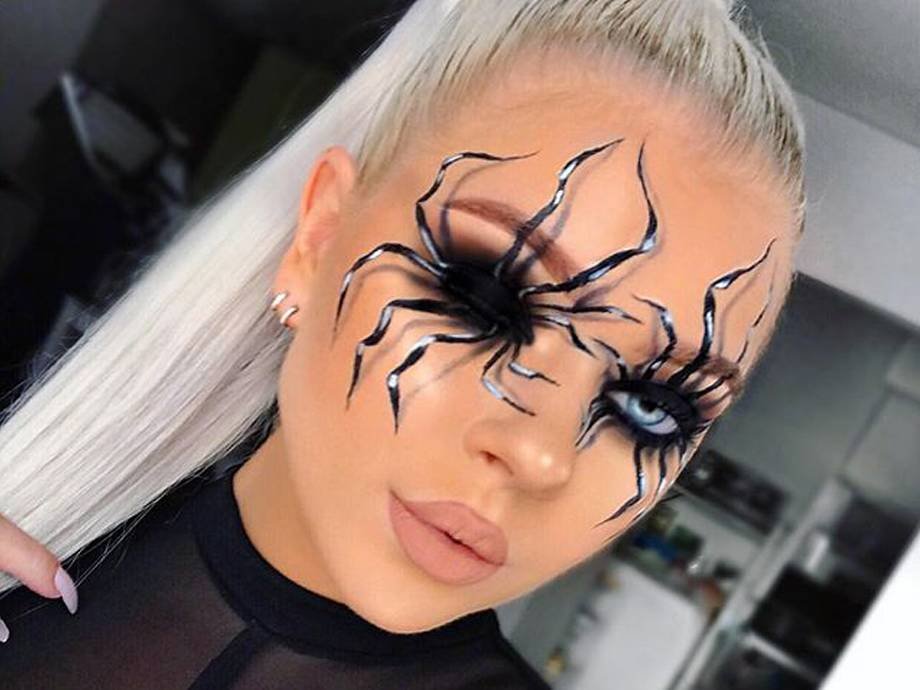 person wearing spider eye makeup