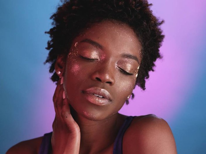 person wearing glitter makeup