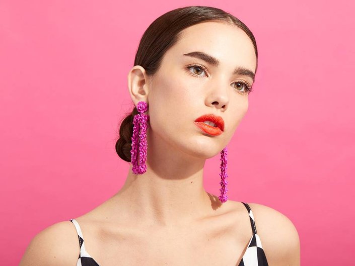 person wearing orangey red lipstick