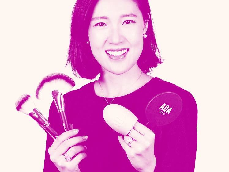 person smiling and holding beauty products