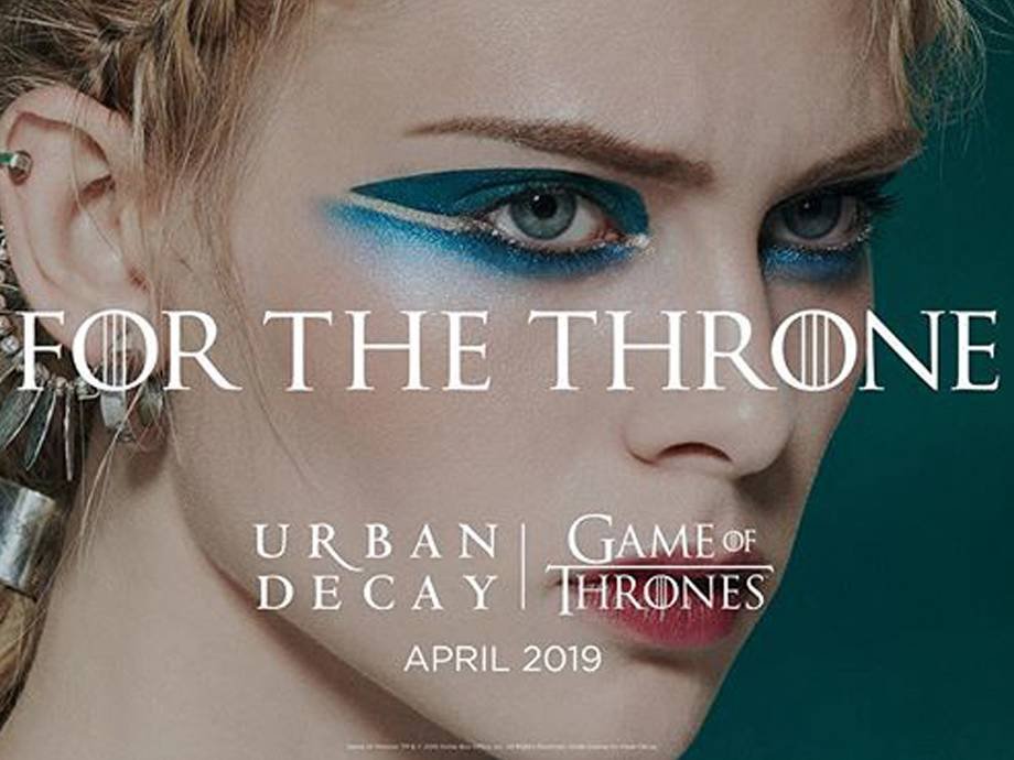 person wearing blue graphic eyeshadow