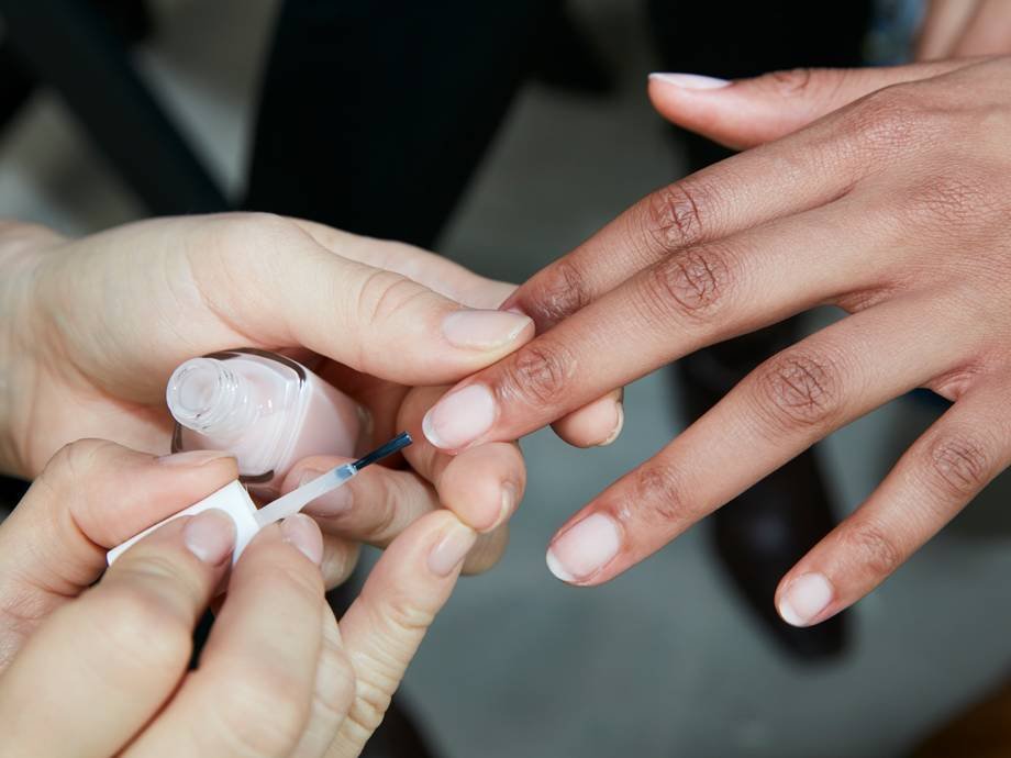 hands polishing someone's nails