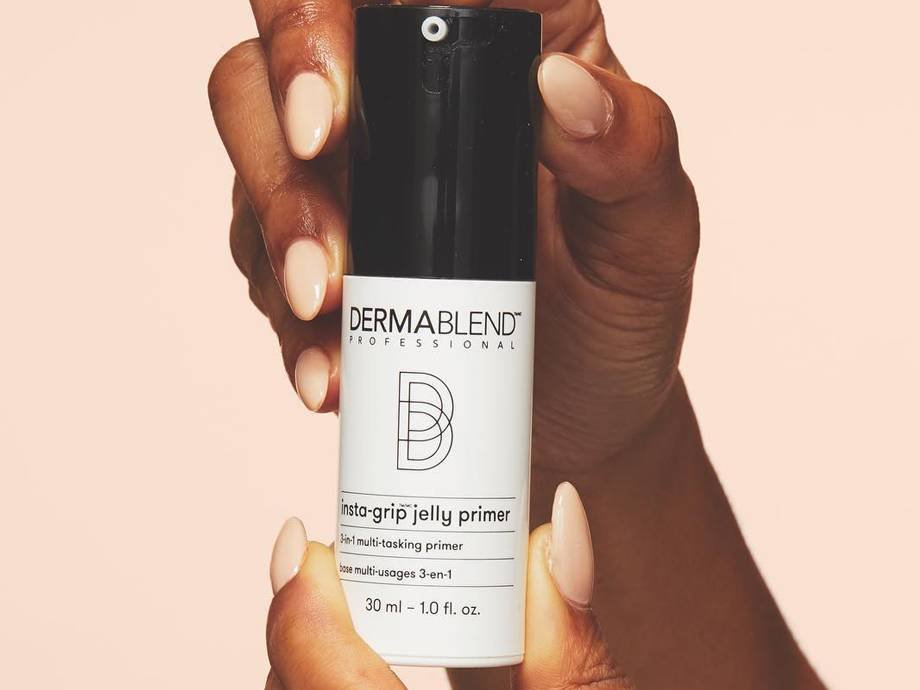 hands holding Dermablend Insta-Grip Jelly Primer