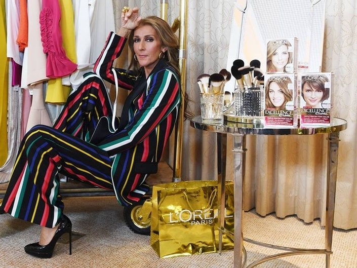 celine dion posing with l'oreal paris products