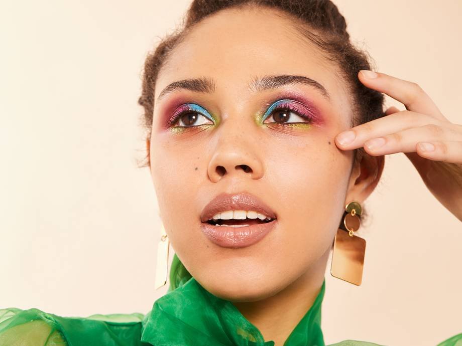 person wearing colorful watercolor eye makeup