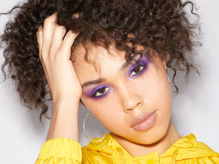person wearing purple eyeshadow on brow bone