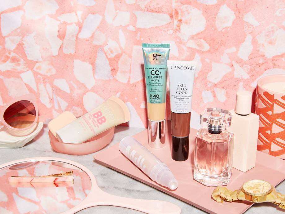 beauty products on pink tray