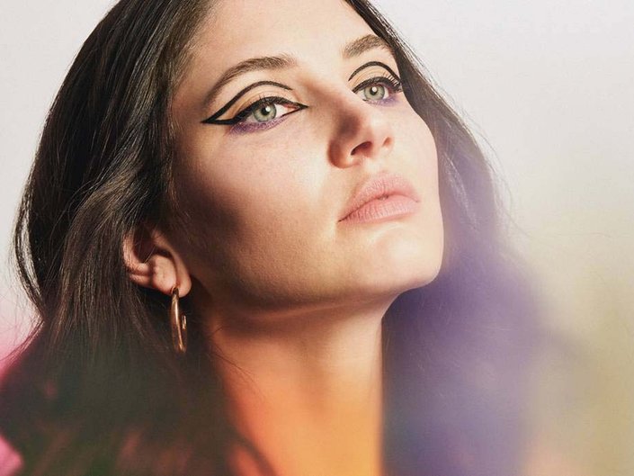 person wearing hollowed-out cat-eye liner