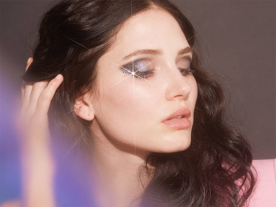 person wearing gradient glitter winged eye makeup