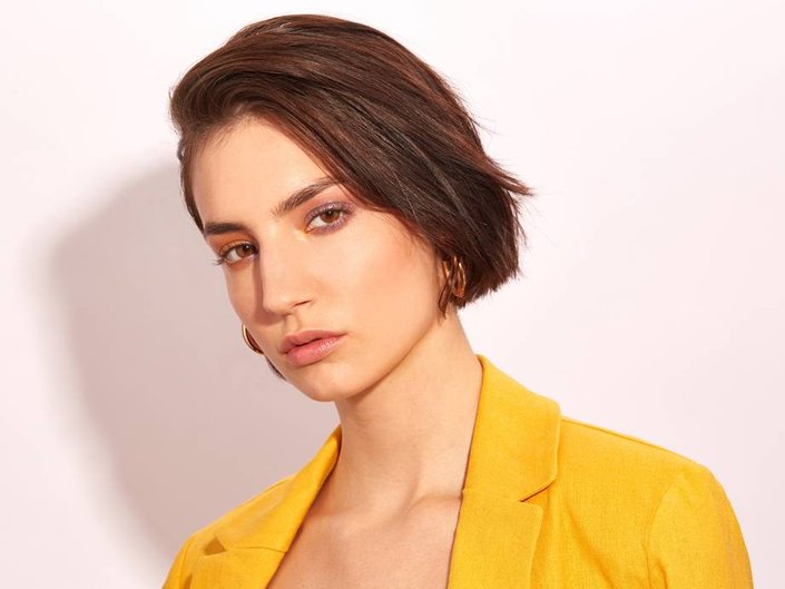 person wearing mismatched colored eyeshadow