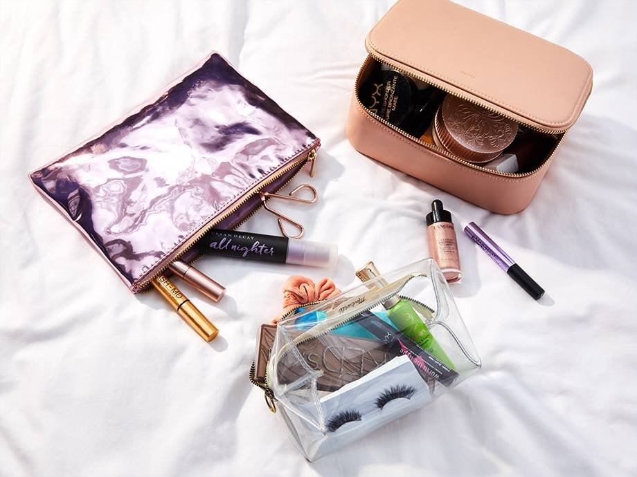 makeup products in makeup bags and travel cases